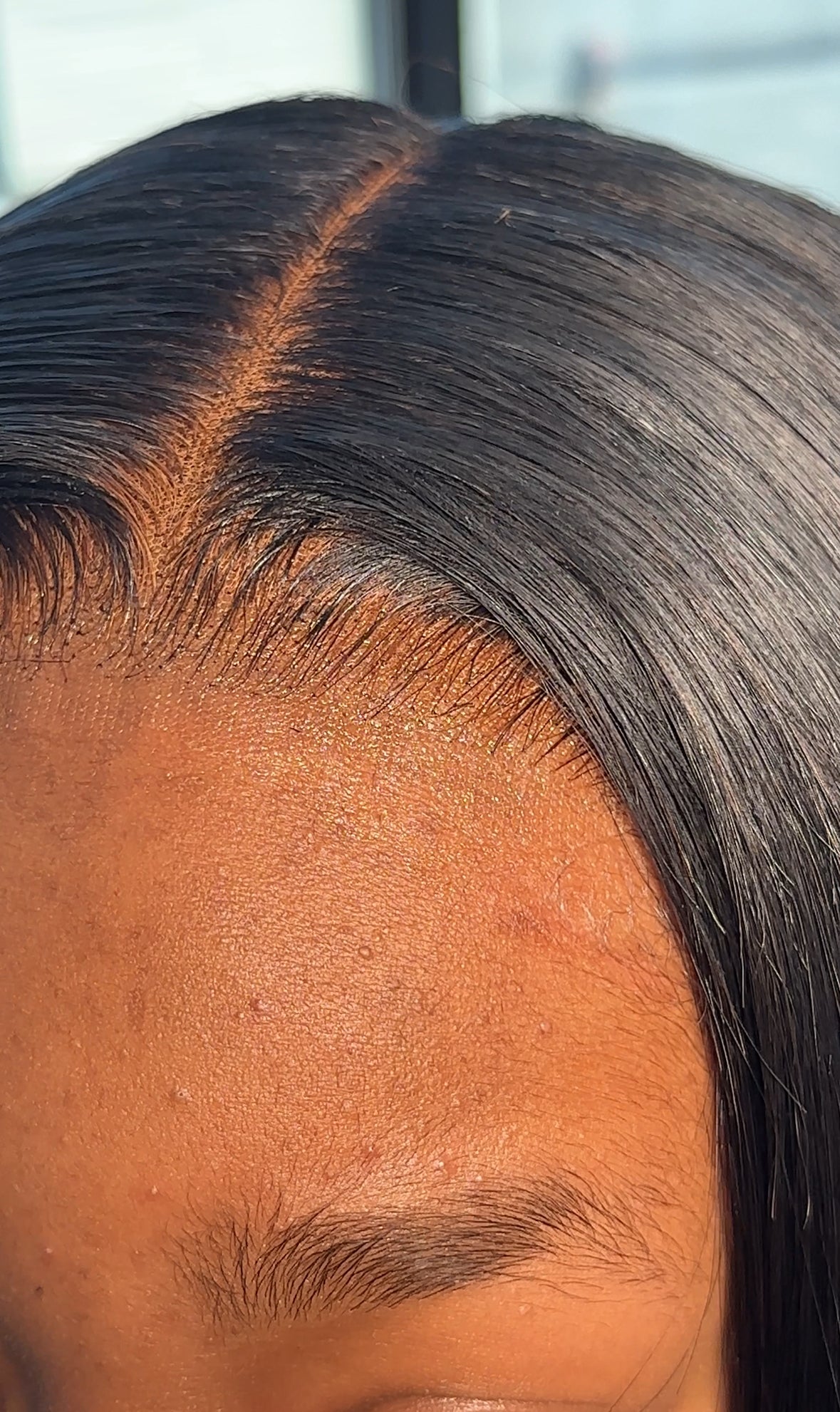 Client wearing an installed 4x4 lace closure — hairline and part detail