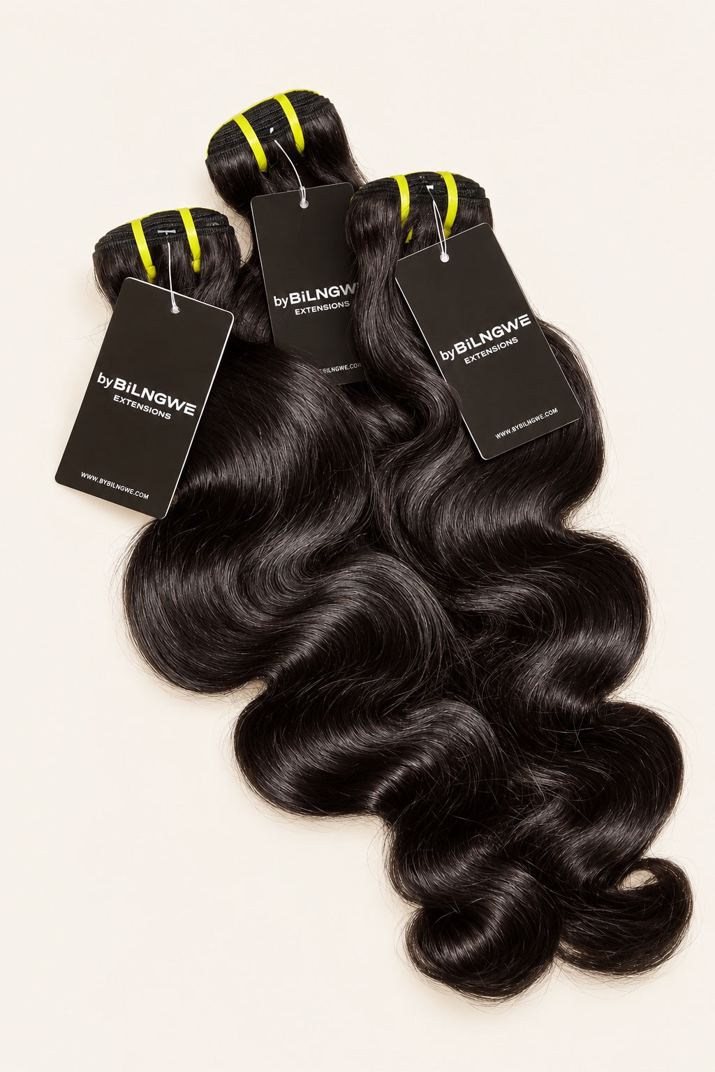 Three byBilngwe Body Wave bundles with product tags