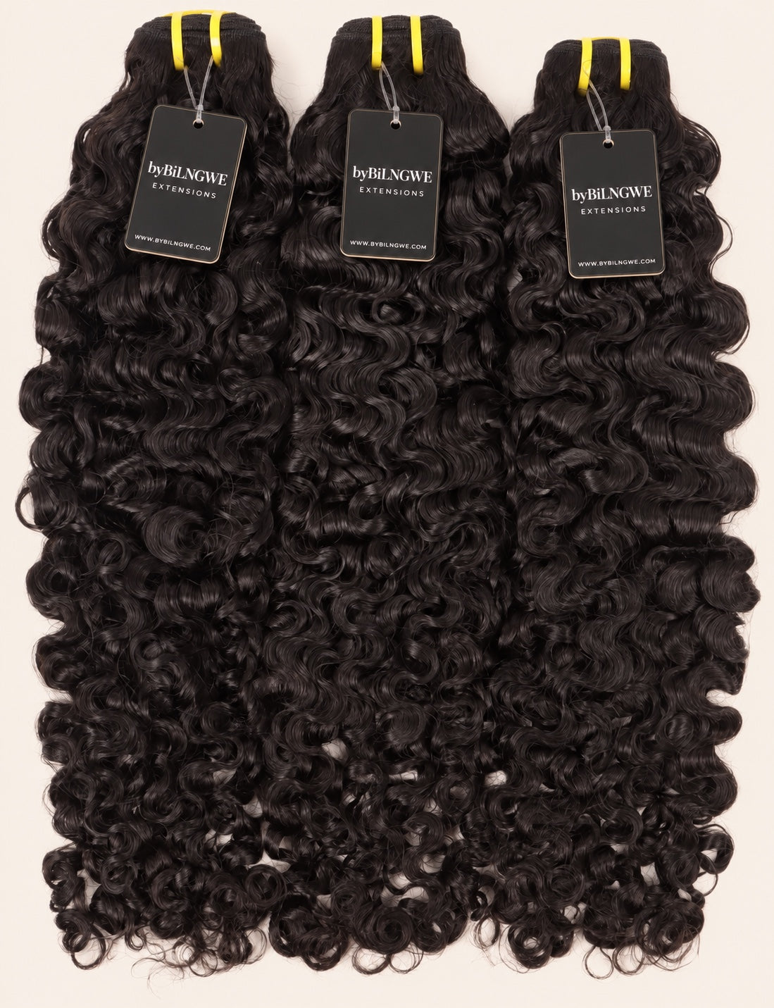 Three byBilngwe Burmese Curly bundles with black extension tags