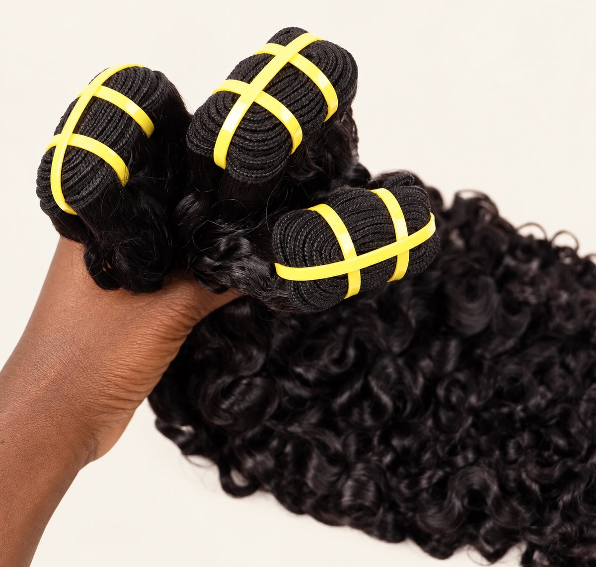 Close-up of byBilngwe Burmese Curly bundle wefts and curl texture
