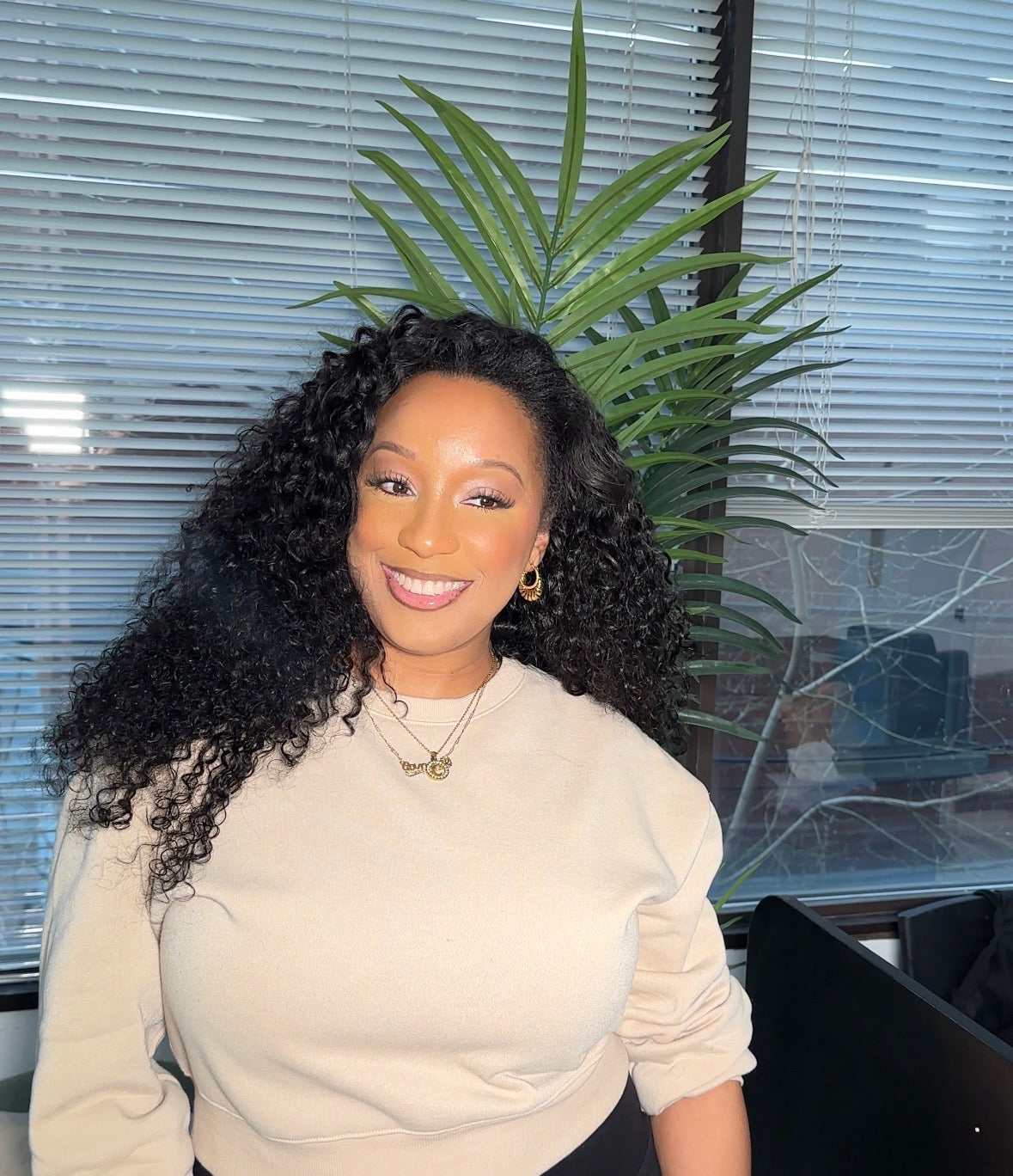 Client wearing installed Burmese Curly bundles